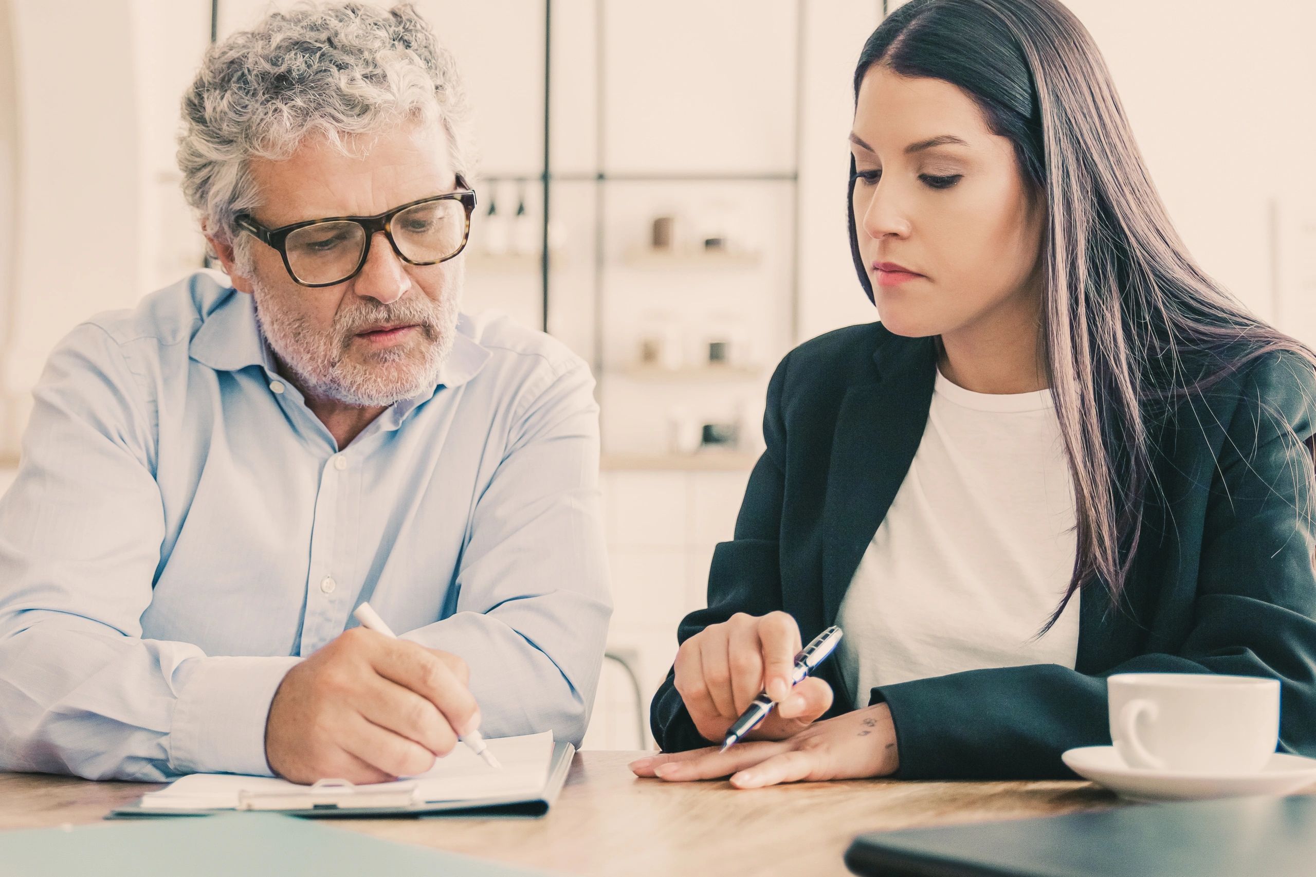 Business owner reviewing insurance paperwork with an advisor