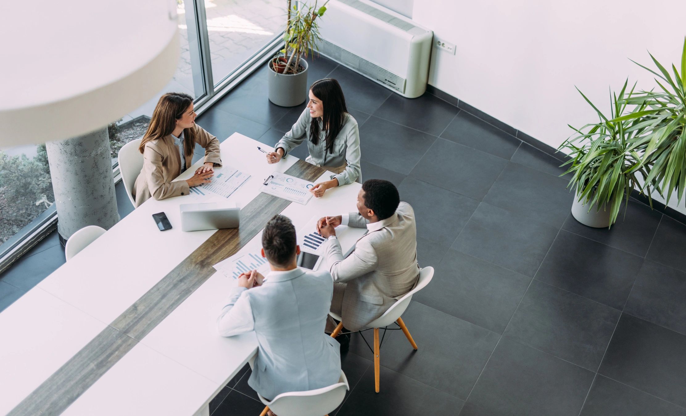 Insurance professionals meeting with clients in an office
