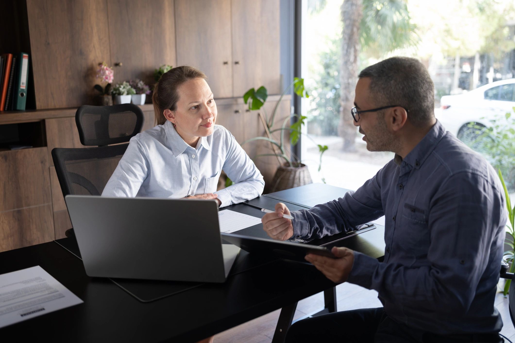 Business professionals discussing a project together