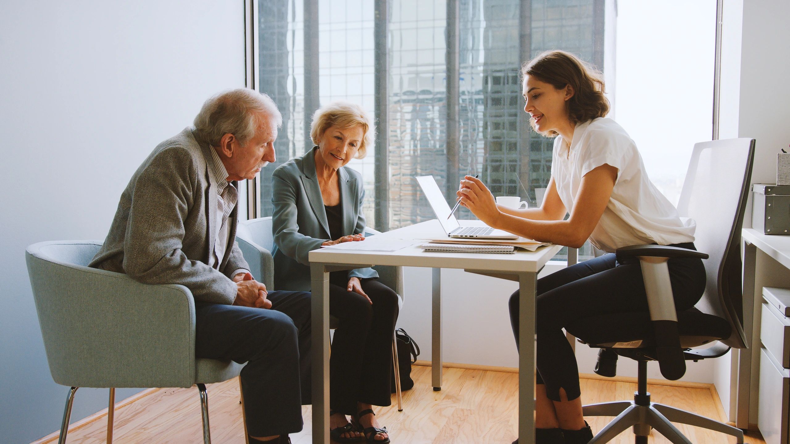 Clients meeting with a financial advisor in an office